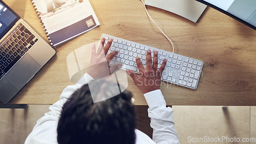 Image of Business person, hands and computer for planning, copywriting and marketing research at office desk above. Worker, writer or editor typing on desktop keyboard for social media branding or information