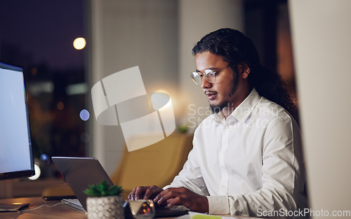 Image of Night, business and man with laptop, typing and connection with programming, code and trading. Person, investor or accountant with a pc, stock market and data analysis with research, evening and tech
