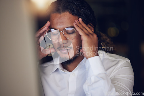 Image of Business man, stress and headache on computer for stock market crash, bankruptcy and night mistake or error. Professional worker or trader pain, depression or frustrated for trading fail on desktop