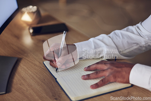 Image of Notebook, pen and hands of professional person writing notes of journalist story, summary and planning project at night. Closeup, journal planner and agent work late on creative brainstorming process