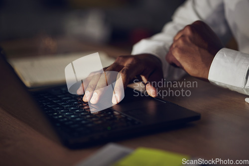 Image of Laptop keyboard, hands and business person typing investment plan, exchange on stock market or reading sales numbers. Economy, cryptocurrency review and night trader working on NFT trading research