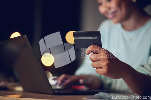 Image of Business woman, credit card and laptop for online shopping, e commerce and financial loan or fintech at night. Professional person or worker typing on computer for banking, payment or subscription