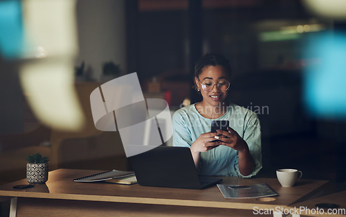 Image of Woman in dark office with phone, typing or reading email, message or social media post connectivity. Late night at work, cellphone and girl at desk networking, online chat or writing text at overtime