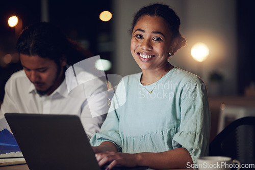 Image of Night, portrait and happy woman in office with laptop, teamwork and typing email, report or review. Overtime, computer and business people in workplace with smile, online schedule planning and bokeh.