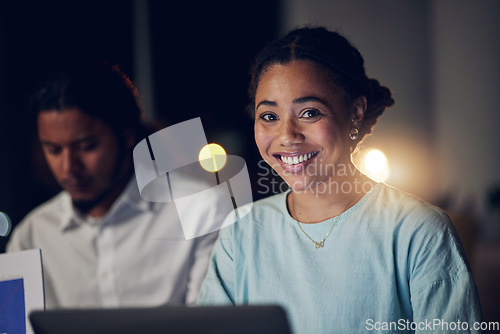 Image of Overtime, portrait and happy woman in office with laptop, teamwork and typing email, report or review. Night, computer and business people in workplace with smile, online schedule planning and bokeh.