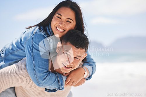Image of Summer, piggyback and portrait of a couple at the beach for a date, love or vacation together. Mockup, smile and a man and woman with a hug at the sea for a holiday, travel or bonding in marriage