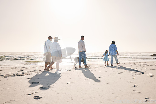 Image of Summer, travel and walking with big family on beach for vacation, bonding and love. Freedom, care and relax with group of people on seaside holiday for generations, happiness and mockup space