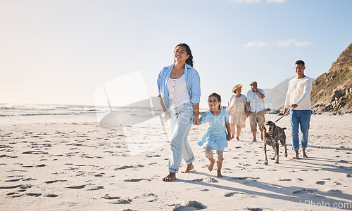 Image of Family, beach and walking outdoor with a dog in summer for fun, freedom and vacation. People, child and a pet travel together on sand at sea on holiday with space, love and happiness in nature