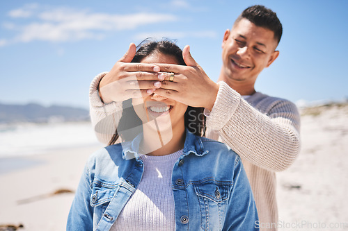 Image of Surprise, cover eyes and people on beach with news, love and couple on romantic date, summer travel outdoor. Man, woman and marriage, secret announcement and bond, adventure and vacation in Mexico