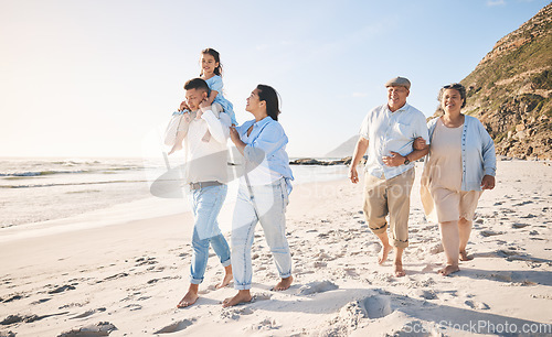 Image of Summer, travel and love with big family on beach for vacation, bonding and fun. Freedom, care and relax with group of people walking at seaside holiday for generations, happiness and support together