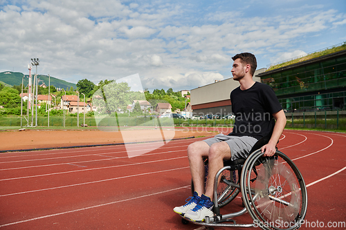 Image of A person with disability in a wheelchair training tirelessly on the track in preparation for the Paralympic Games