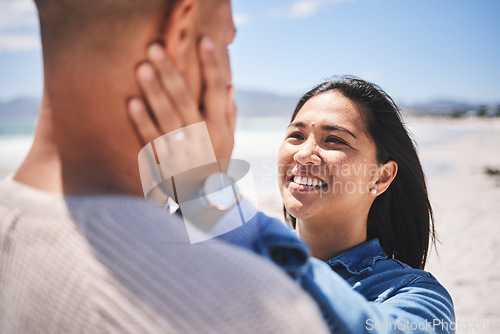 Image of Beach, love and couple with hands on face for love, commitment and bonding in nature. Travel, summer and man and woman together by ocean for care, trust and affection on holiday, vacation and weekend