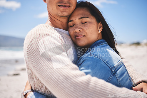 Image of Love, hug and relax with couple at beach for travel, summer vacation and romance together. Calm, embrace and bonding with man and woman walking on seaside holiday for care, date or honeymoon