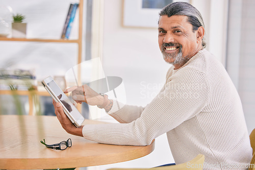 Image of Smile, tablet and portrait of a man in the office browsing on social media, mobile app or internet. Happy, positive and professional mature male designer networking on digital technology in workplace