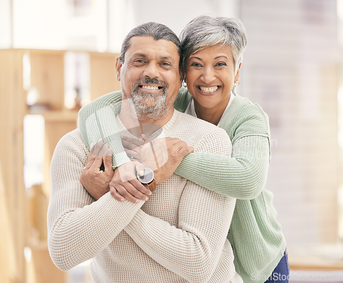 Image of Happy elderly couple, portrait and hug with love in living room bonding, romance or embrace together at home. Mature man or woman smile in happiness for loving relationship, affection or commitment