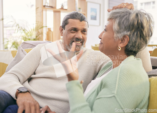 Image of Love, mature couple and talk on sofa in home for happy chat, care and conversation together with marriage partner. Man, woman and speaking on couch in support, loyalty or communication in living room