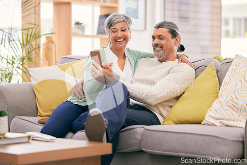 Image of Phone, happy and mature couple on sofa with smile for social media post, internet and browse website. Marriage, love and man and woman on smartphone in living room for bonding, funny meme and relax