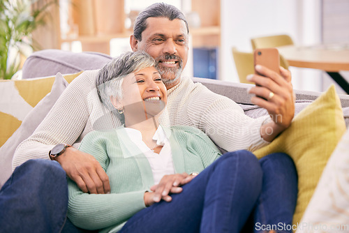 Image of Selfie, happy and mature couple on couch with smile for social media post, profile picture and memories. Marriage, love and man and woman take photo in living room for bonding, relationship and relax