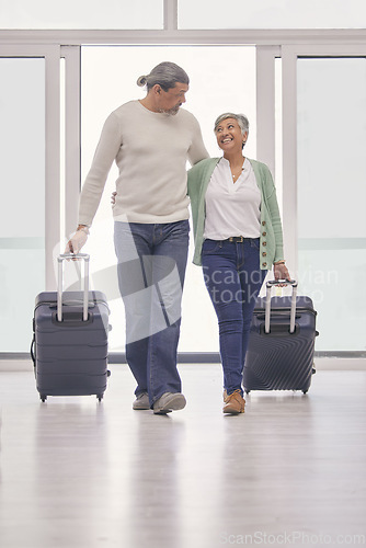 Image of Mature couple, luggage and walking in airport lobby, happy and travel together, tourist holiday and vacation. Man, woman smile and suitcase for flight, immigration journey and global airplane trip