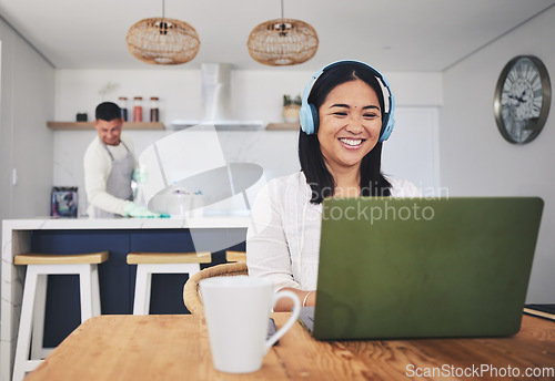 Image of Remote work from home, smile and woman with a laptop, connection and typing with website information. Person, employee or freelancer with a pc, house and happiness with headphones, project or network