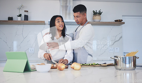 Image of Tablet, cooking and couple in a kitchen, recipe and bonding with love, marriage and conversation. Home, man and woman with technology, online reading and nutrition with instructions and prepare lunch