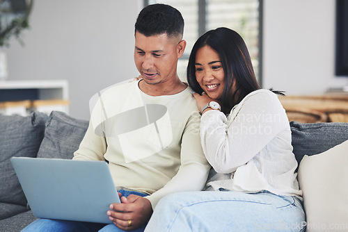 Image of Relax, laptop and couple on a sofa in the living room doing online shopping together at home. Happy, love and young man and woman browsing on social media or the internet with computer at their house