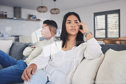 Image of Frustrated couple, fight and conflict in divorce, argument or disagreement on living room sofa at home. Unhappy man and woman in breakup, cheating affair or dispute from toxic relationship in house