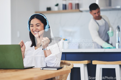 Image of Laptop, music and remote work with a winner woman in her home reading news about a bonus or promotion. Computer, celebration and headphones with a happy young entrepreneur cheering freelance success