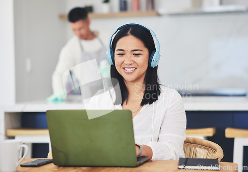 Image of Remote work from home, headphones and woman with a laptop, copywriting and typing with research. Person, employee or copywriter with pc, kitchen and business owner with headset, project or connection