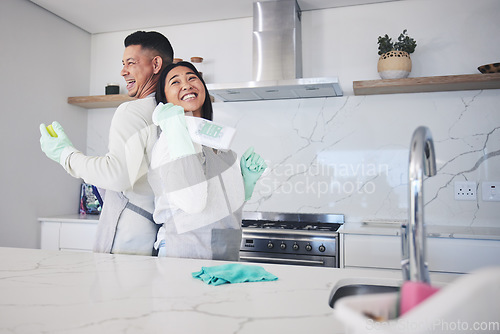 Image of Happy, love and couple cleaning in kitchen for hygiene, safety and prevention of bacteria at home. Spring clean, bond and man with woman smile for household, housework or fun while sharing chores