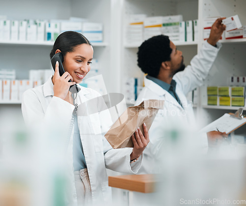 Image of Pharmacist, phone call and medicine package for customer service, healthcare communication or inventory support. Medical worker, people or doctor on telephone with pharmacy product or paper bag check