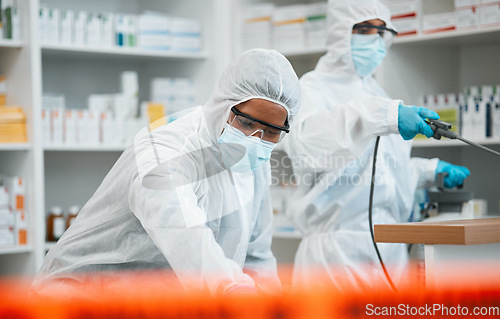 Image of Pharmacy, emergency disinfection and people spray chemical for protection, cleaning hospital or contamination risk. Safety policy, toxic bacteria outbreak or healthcare team sanitize medical facility