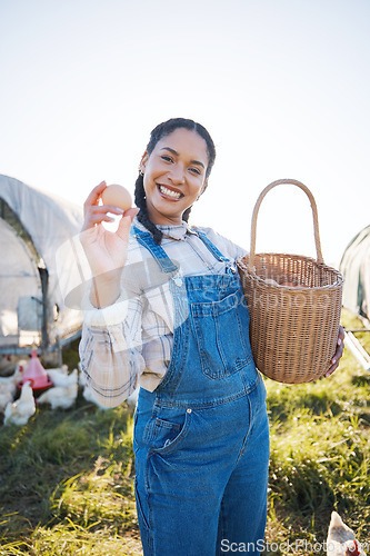 Image of Egg, portrait and happy woman farming chicken in countryside for eco friendly dairy production. Natural sustainability, small business owner or proud farmer with animals on field or organic barn