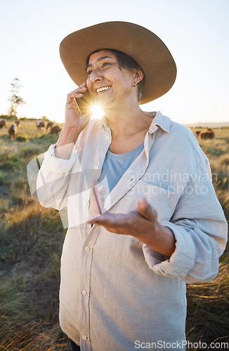 Image of Woman, farmer and phone call in morning, countryside and person on farm with smile for live stock in nature with connection. Happy, female worker and social network, communication and contact