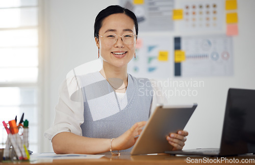 Image of Portrait of Asian woman at desk with smile, tablet and research for business website, online report or social media. Internet, digital app and businesswoman in office with web schedule and confidence