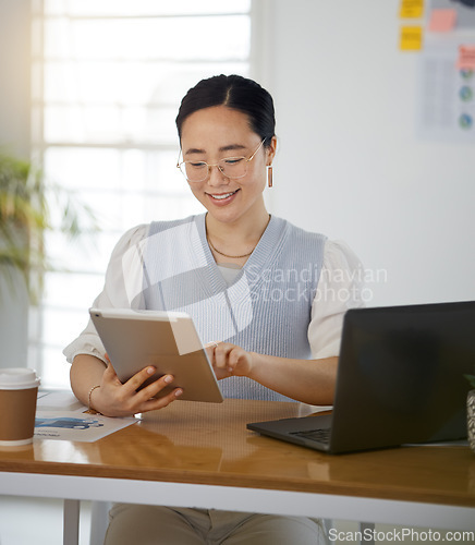 Image of Asian woman at desk with smile, tablet and scroll for research on business website, online report or social media. Internet, digital app and businesswoman in office on web schedule and reading email.