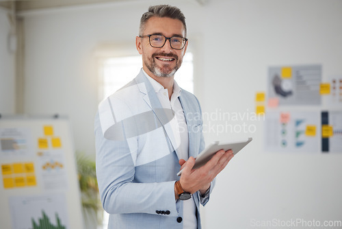 Image of Portrait of mature man in office with tablet, smile and research for business website, online report or social media. Internet, digital app and businessman with workshop, web schedule and confidence.