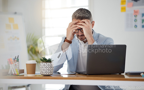 Image of Laptop, headache and stress with a business man in the office for deadline management as a professional boss. Computer, anxiety and burnout with a corporate employee under pressure in the workplace