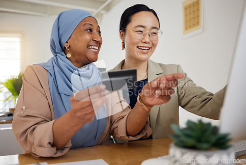 Image of Online shopping, credit card and woman at customer service desk for banking and talking to a consultant. Muslim, asian and professional consulting a customer on rewards purchase on business website