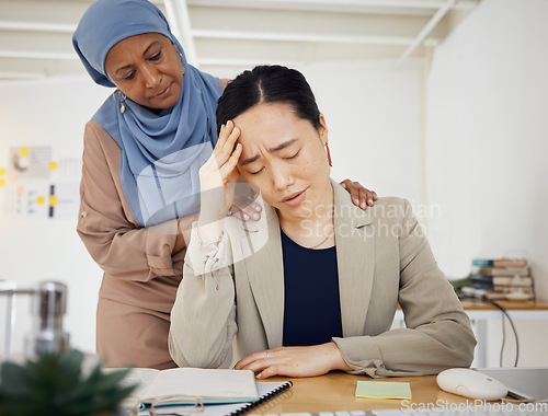 Image of Stress, depression and a business woman with empathy, support and help in office. Burnout, fired and entrepreneur person with headache, bad news or fatigue with hand of muslim friend on shoulder