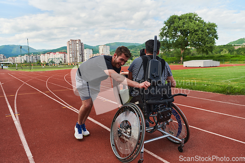 Image of A cameraman filming the participants of the Paralympic race on the marathon course