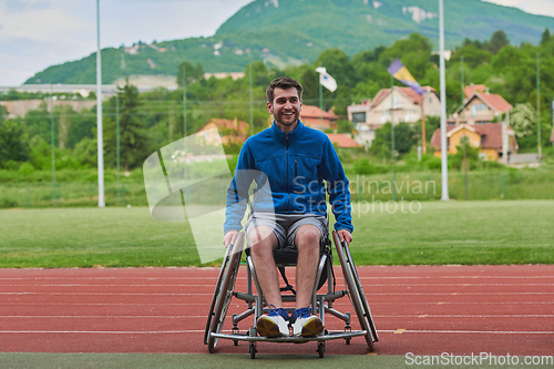 Image of A person with disability in a wheelchair training tirelessly on the track in preparation for the Paralympic Games