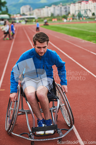 Image of A person with disability in a wheelchair training tirelessly on the track in preparation for the Paralympic Games