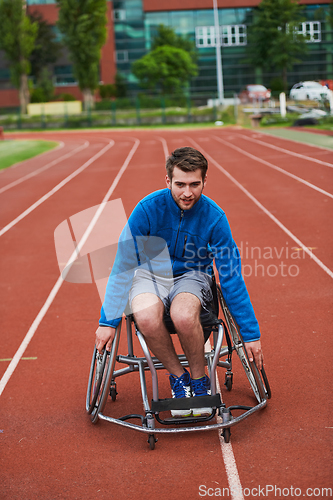 Image of A person with disability in a wheelchair training tirelessly on the track in preparation for the Paralympic Games