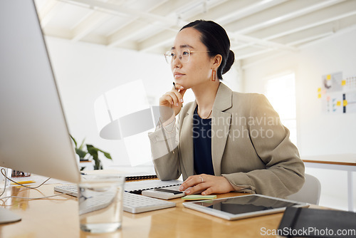 Image of Business woman, computer and thinking, planning or problem solving for marketing, website design or project. Professional asian person with focus, decision or choice on desktop for creative solution