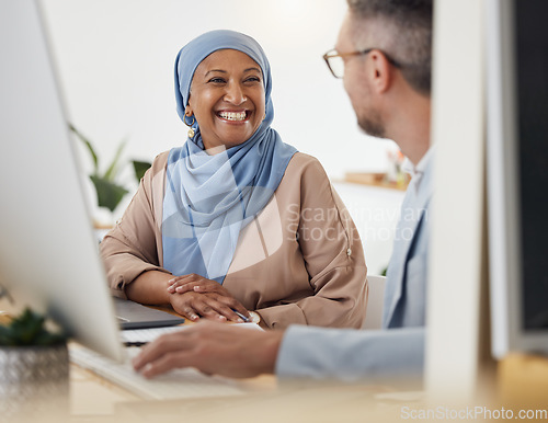 Image of Smile, teamwork and business people in office for training, advice or collaboration while working on computer. Smile, help and Muslim senior woman mentor laugh with colleague while brainstorming idea
