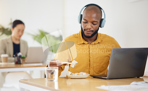 Image of Delivery, fast food and black man with laptop in office for lunch break, eating and meal. Sushi, brunch and African manager online with positive review, survey or feedback for takeout order service