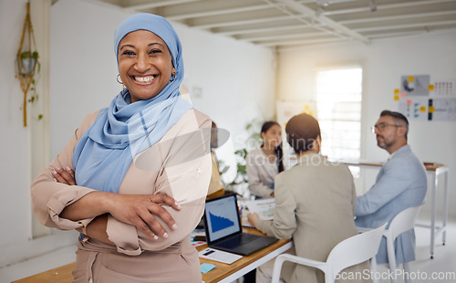 Image of Ceo, Muslim woman and arms crossed portrait of business manager in a office with a smile. Company leader, management and mature female professional with a hijab ready for a website team meeting