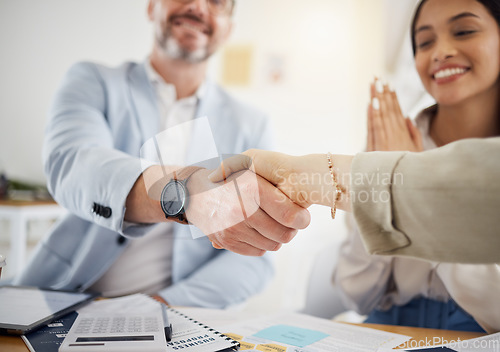 Image of Business people, handshake and meeting in team hiring, partnership or growth together at office. Closeup of employees shaking hands in team agreement, b2b deal or thank you in recruiting at workplace