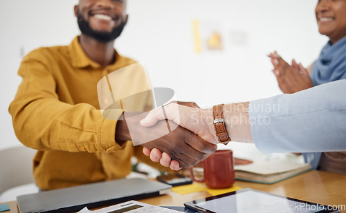 Image of Creative people, handshake and meeting in celebration, promotion or partnership in teamwork at office. Happy employees shaking hands in team recruiting, agreement or deal in startup at the workplace